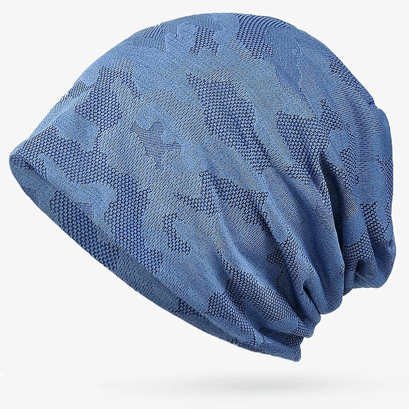 Blue geometric pattern baggy beanie, unisex and stretchy, made from cotton and polyester, offering sun protection.